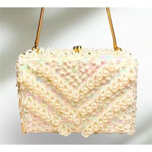 Elegant Cream Clutch with Pearl Embellishments and Wristlet